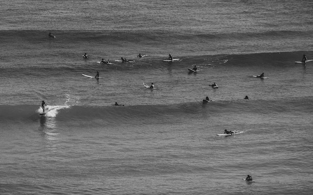 Surf crowd enjoying the waves in classic day